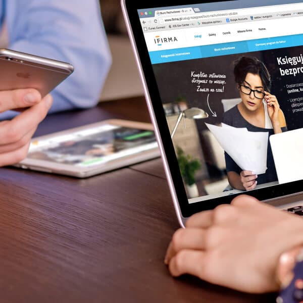A client consultation over a laptop and tablet
